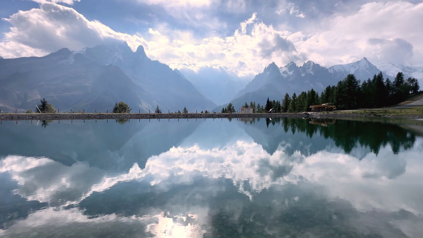The Mont Blanc massif mirrored in a still lake