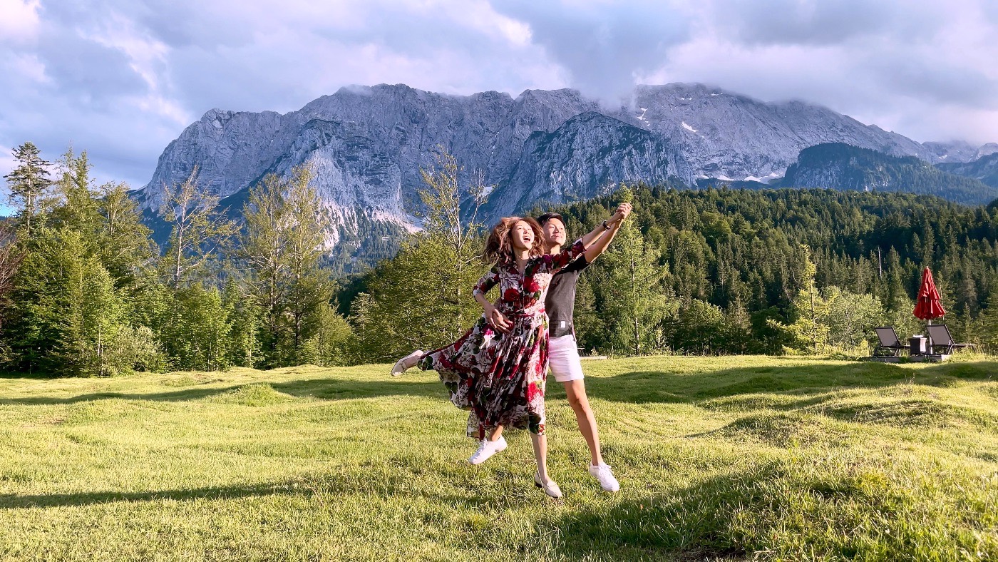 A couple dancing in an alpine meadow below the Wetterstein massif near Garmisch