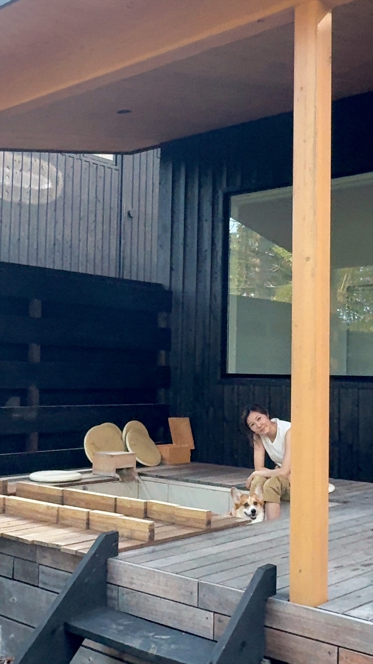 The owner and Scottie relaxing on the villa deck beside the open-air bath