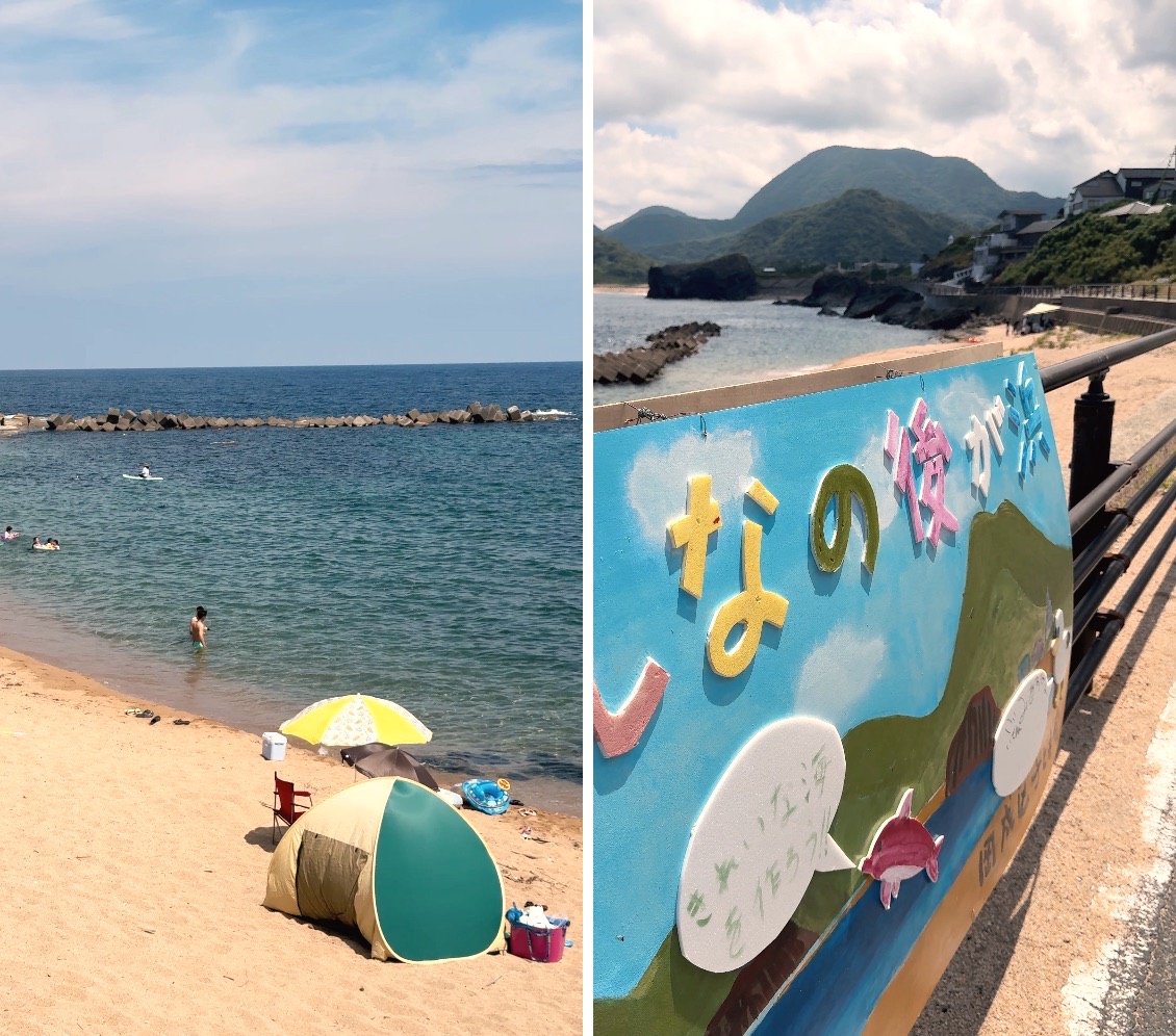 A hand-painted beach signboard over the bay, and the sandy swimming beach with tents and umbrellas